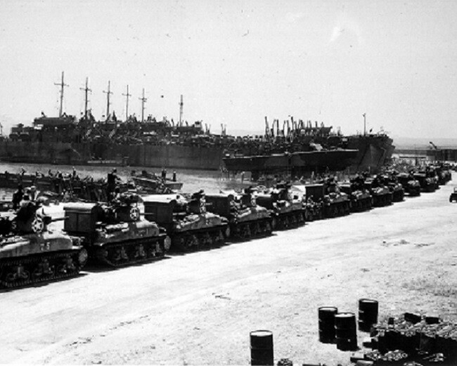 L.S.T’s lined up and waiting for tanks to come aboard WWII 8×10 Photo 370a