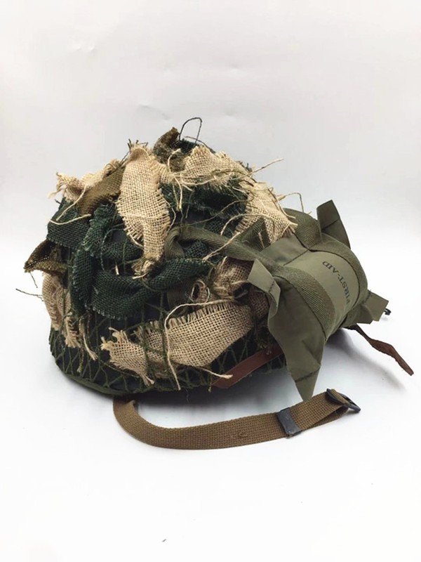 WW2 US ARMY ALRBORNE M1C HELMET WITH AIRBORNE TROOPS AND CAMOUFLAGE NET gallery